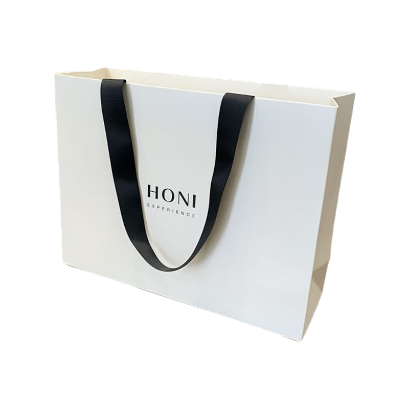 Aangepaste mode luxe geschenkzakken Wit papieren zak Winkelen verpakkingstas voor kleding